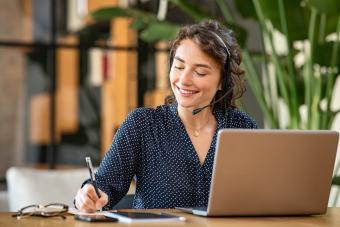 Female on the phone and computer