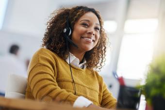 Person with headset on talking to customer. 